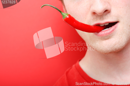 Image of Eating chili pepper