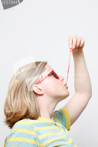 Image of Girl playing with gum