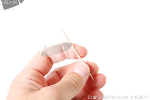 Image of Hand holding toothpicks