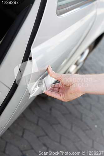 Image of Opening car door