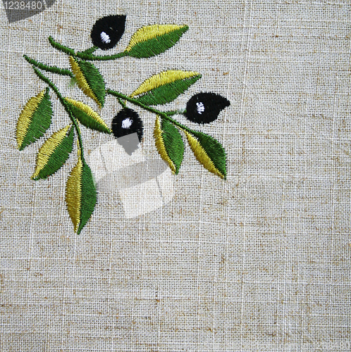 Image of Embroidery of olive branch on linen beige fabric 
