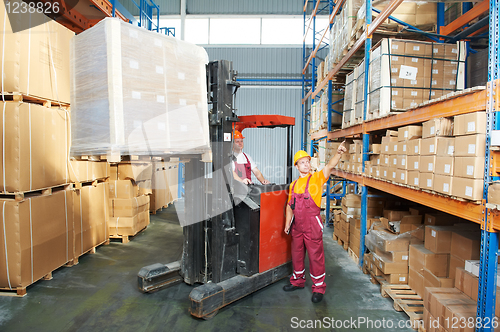 Image of distribution in warehouse with forklift