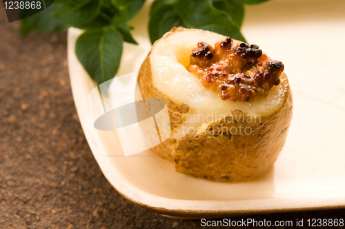 Image of Baked potato with sour cream, grain Dijon mustard and herbs