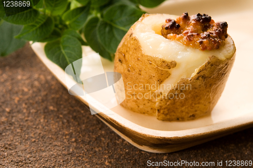 Image of Baked potato with sour cream, grain Dijon mustard and herbs