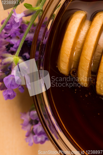 Image of lavender honey with fresh flowers. sweet food 