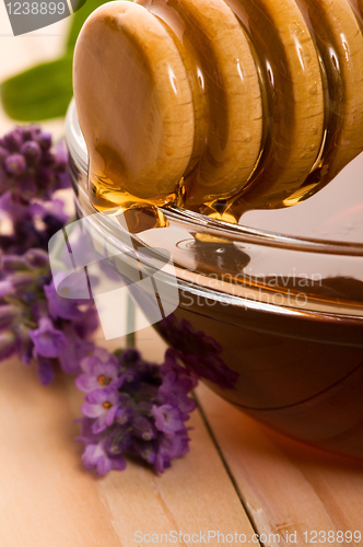 Image of lavender honey with fresh flowers. sweet food 