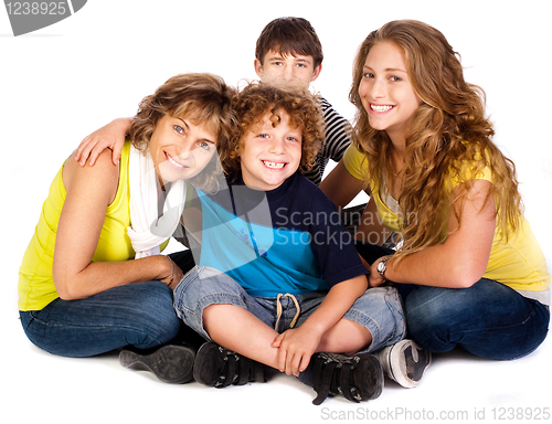 Image of Happy young smiling family with two boys