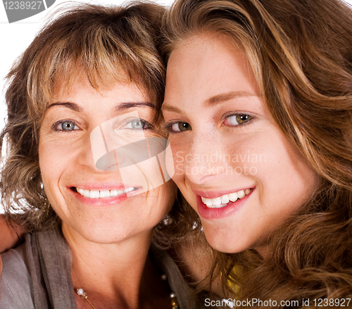 Image of Close-up of smiling elder mum and daughter