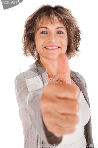Image of Senior woman gesturing thumbs-up