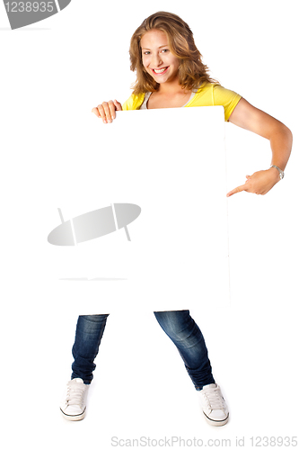 Image of Happy young woman holding a blank billboard