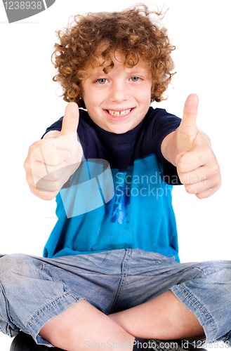 Image of Young kid showing double thumbs up