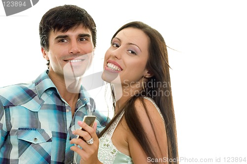 Image of Smiling couple enjoying music together