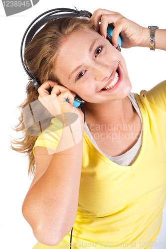 Image of Attractive girl enjoying music