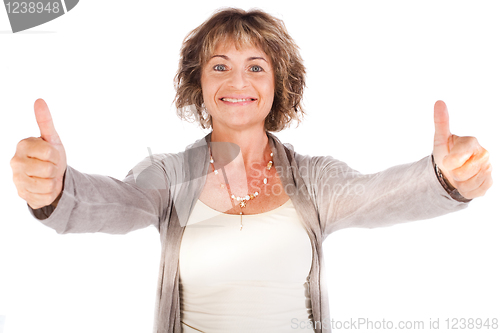 Image of Gorgeous senior lady showing thumbs-up