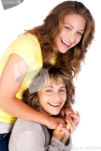 Image of Portrait of smiling matured mum with her daughter