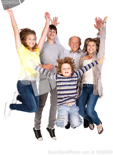 Image of Happy family jumping high