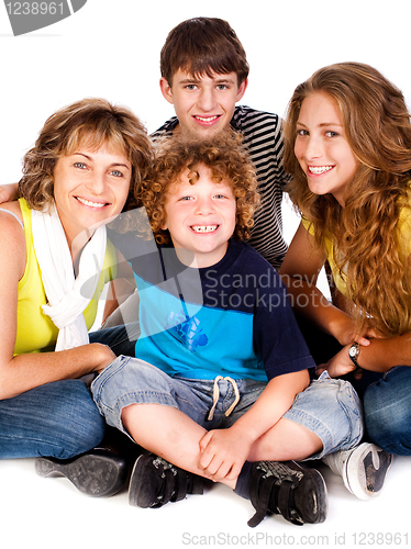 Image of Happy young smiling family with two boys