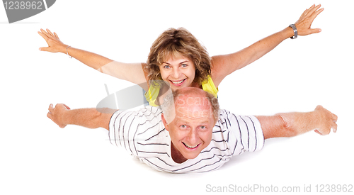 Image of Senior couple having fun, indoors