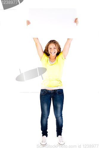 Image of Young sexy woman holding empty white board