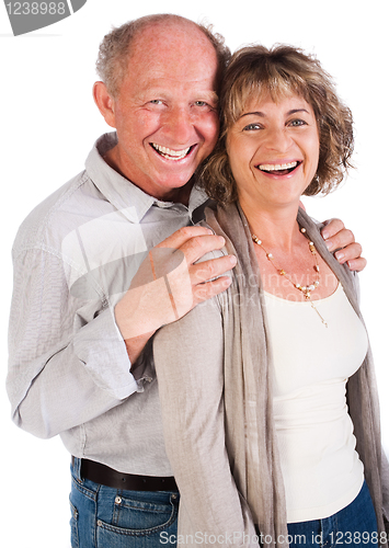 Image of Happy senior couple smiling at camera