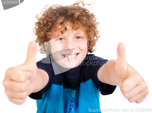 Image of Smilling cute little boy gesturing thumbs up
