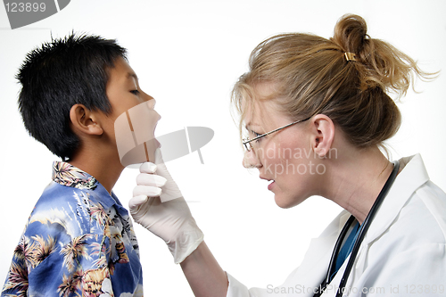 Image of Child having a routine physical exam by doctor