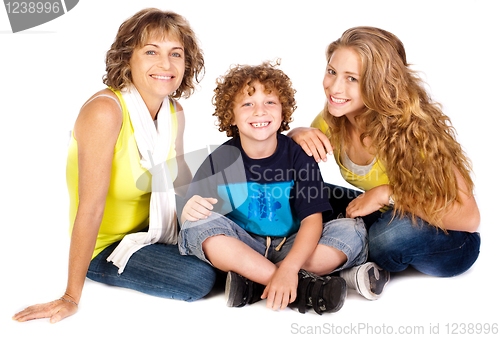 Image of Family having fun on the floor, smiling at camera