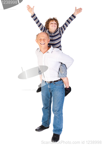Image of Grandfather giving grandson piggy-back