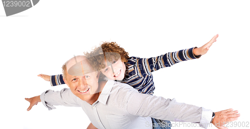 Image of Grandfather giving grandson piggy-back