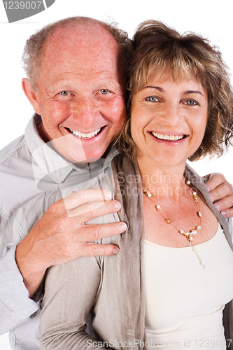 Image of Affectionate old man hugging his wife from behind