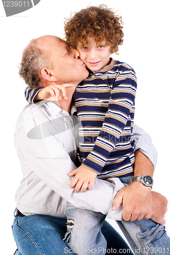 Image of Grandson kissing his grandfather