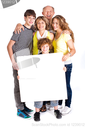 Image of Portrait of a happy family holding a billboard