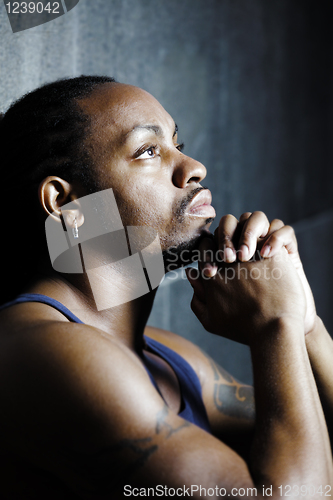 Image of Young African American portrait,  cement background
