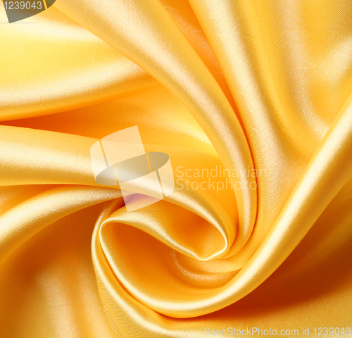 Image of Smooth elegant golden silk as background 