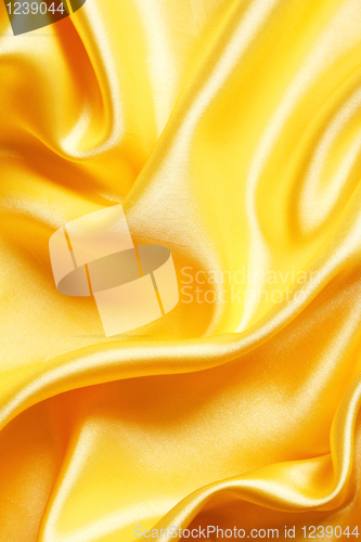 Image of Smooth elegant golden satin as background 