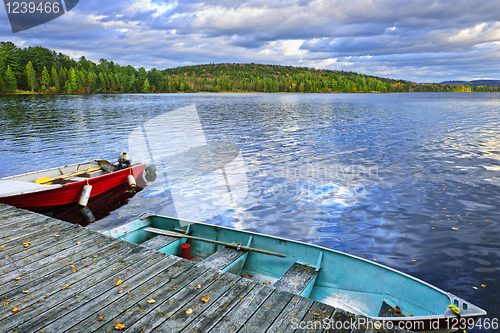 Image of Rowboats on lake at dusk