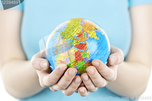 Image of Hands holding globe