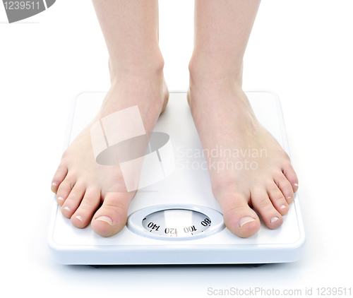 Image of Feet on bathroom scale