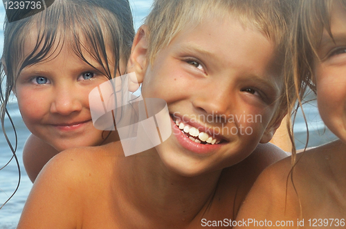 Image of happy friends on the beach