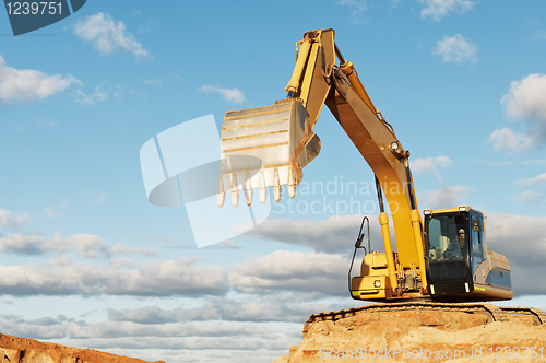 Image of track-type loader excavator at construction area