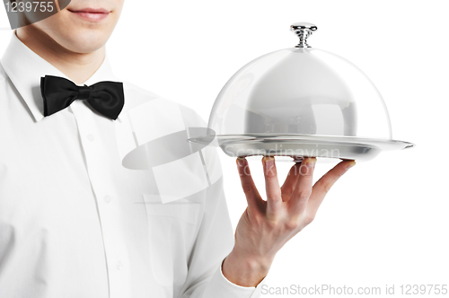 Image of hand of waiter with cloche lid cover