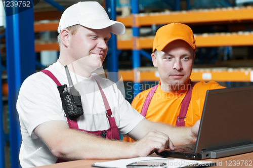 Image of manual workers in warehouse