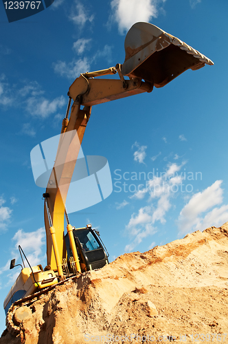 Image of track-type loader excavator at construction area