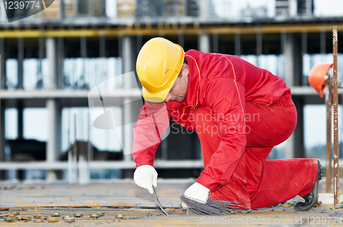 Image of construction worker making reinforcement