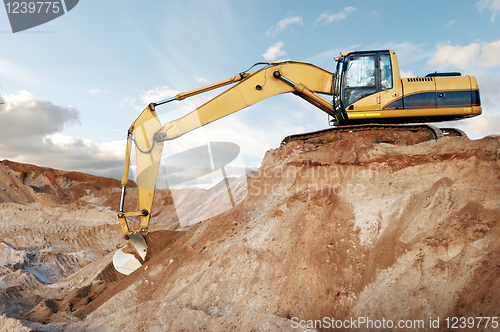 Image of track-type loader excavator at construction area