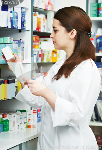Image of Pharmacy chemist woman in drugstore