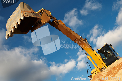 Image of track-type loader excavator at construction area