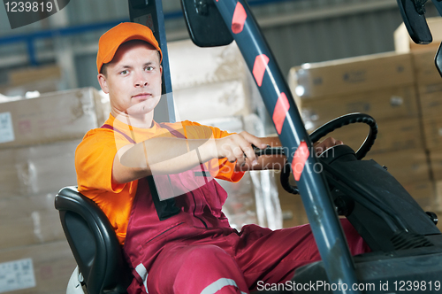 Image of warehouse forklift loader worker