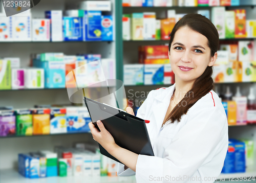 Image of Pharmacy chemist woman in drugstore