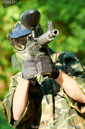 Image of paintball player holding fire